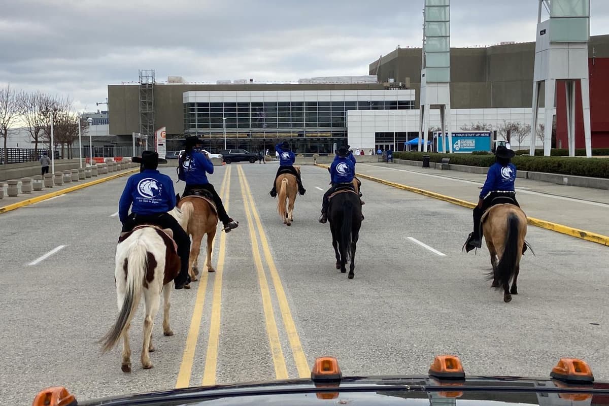 ASCA riders on horseback in matching club shirts